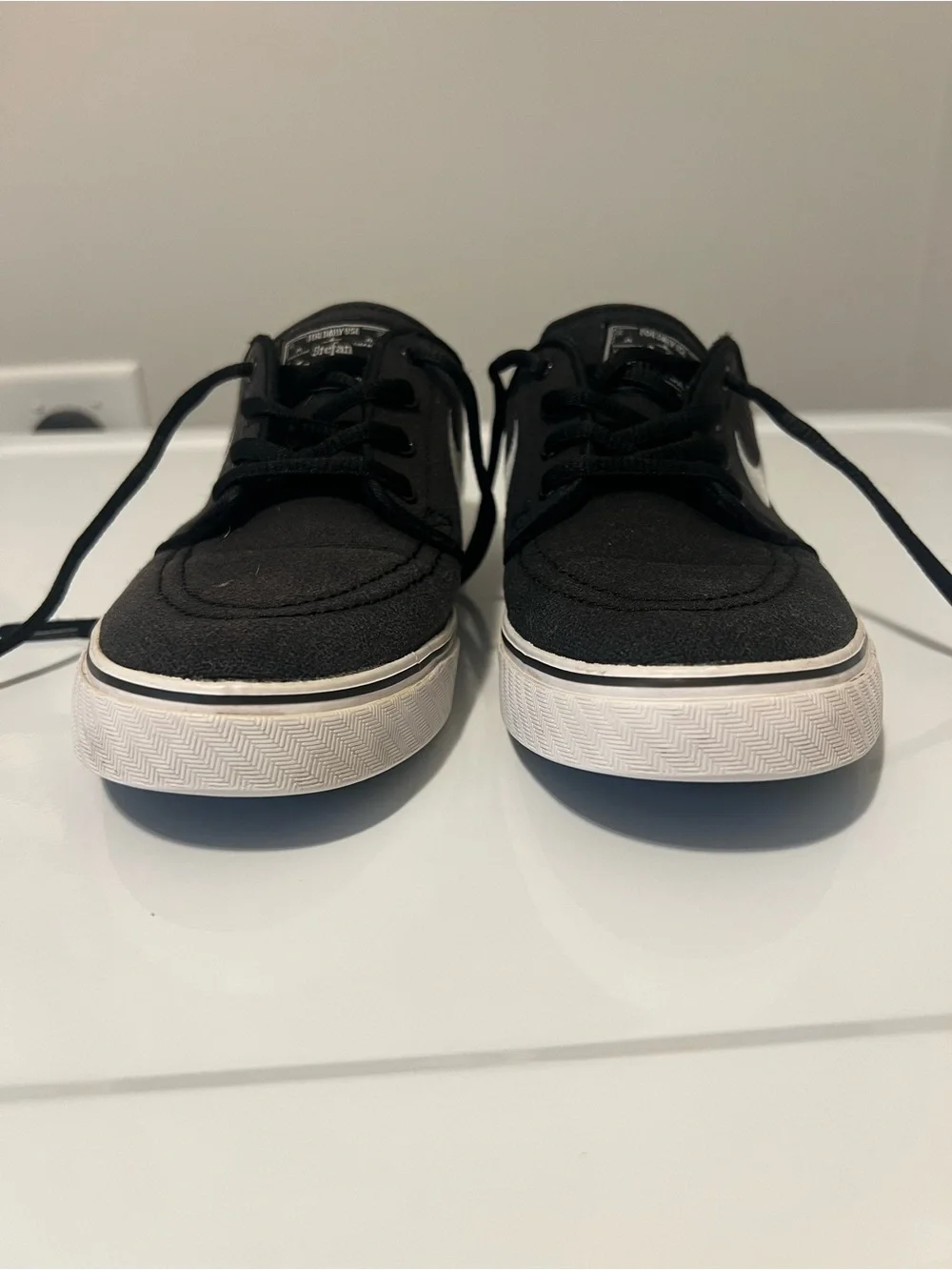 Nike Black Low-Top Sneakers with White Swoosh